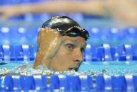 Caeleb Dressel reacts after winning his heat in the men's 100 freestyle during wave 2 of the U.S. Olympic Swim Trials on Wednesday, June 16, 2021, in Omaha, Neb.(AP Photo/Charlie Neibergall)