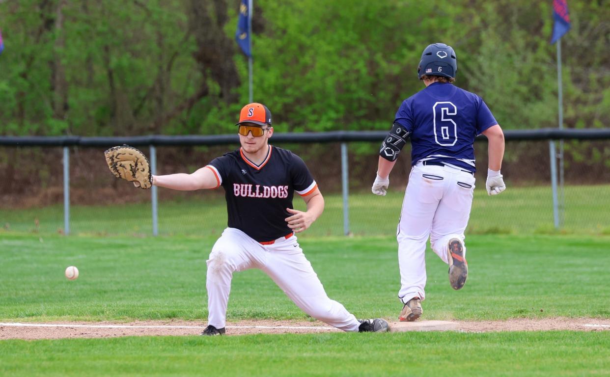 Brenden Myshock of Summerfield tries to dig out a low throw against Whiteford on Thursday, April 18, 2024. The Whiteford runner is Jake Scott. The Bobcats swept the doubleheader 9-3 and 11-1.