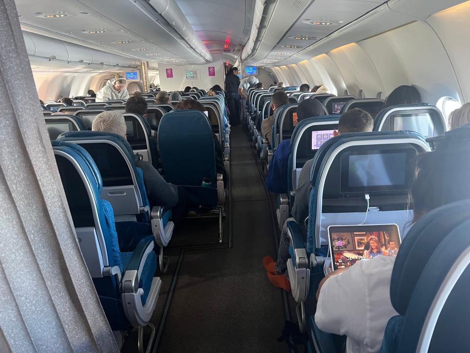 View of the aisle from the back of the aircraft.