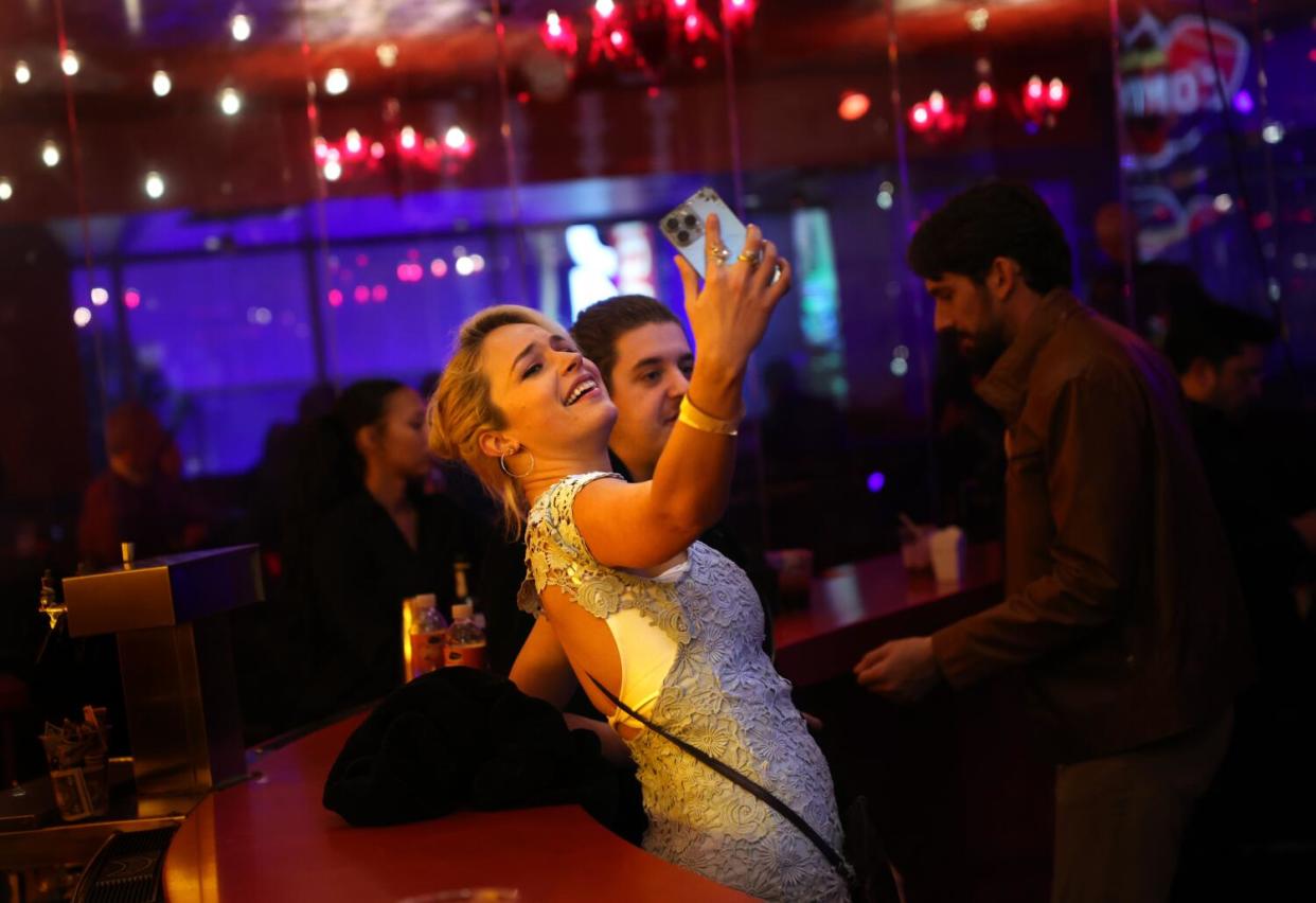 Guests pose for photos at the Conga Room during its farewell show.