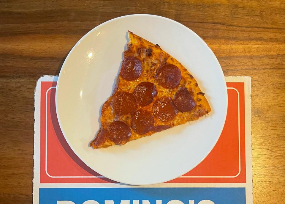 Dominoes pepperoni pizza on a box