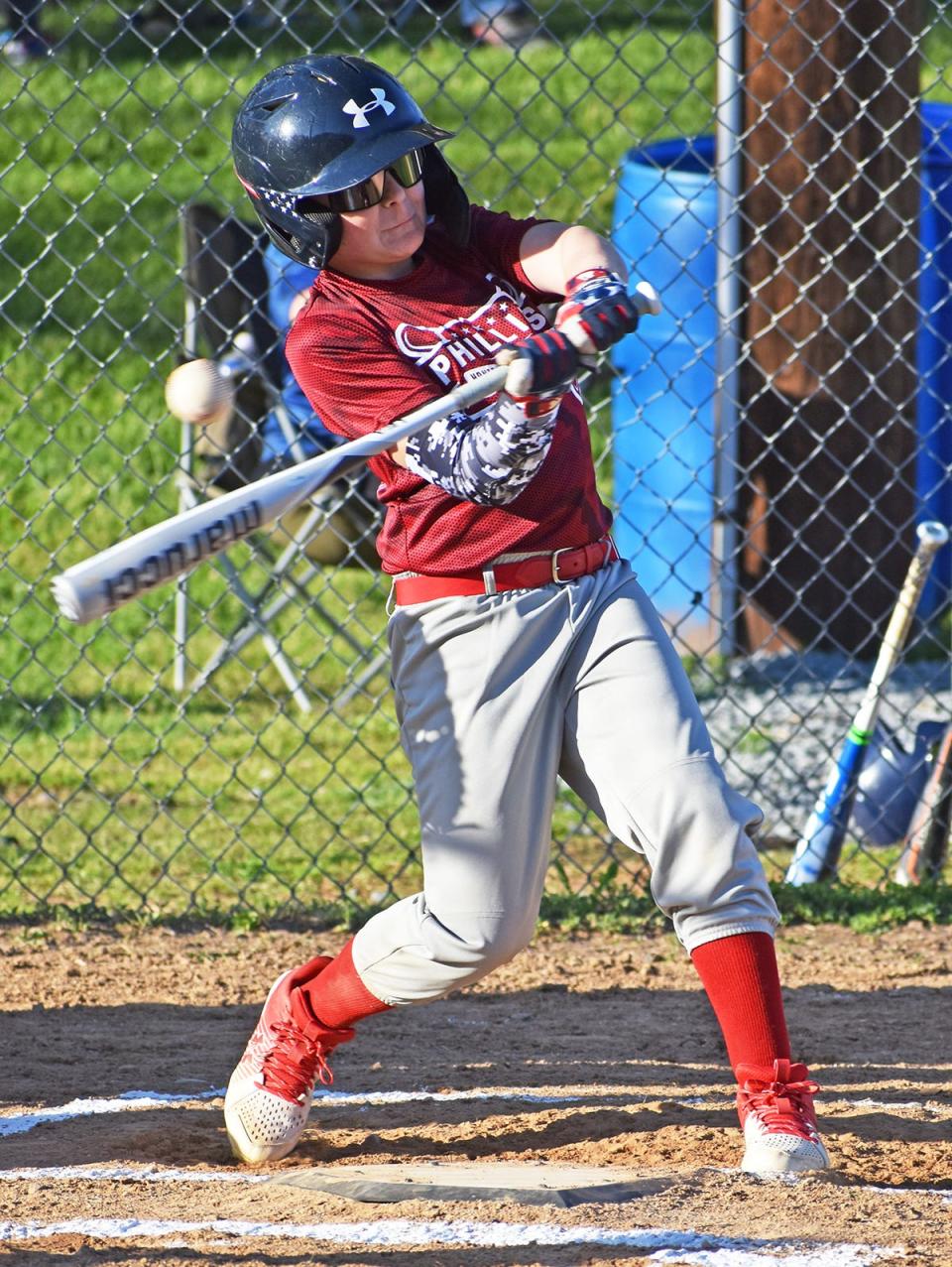 Honesdale National Bank Phillies slugger Kaylem Kresge fights off a tough pitch during Opening Day action of the Honesdale Little Baseball Association's 2023 campaign.