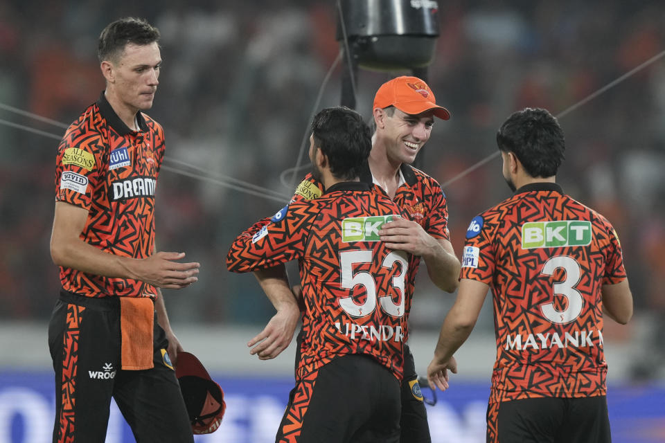 Sunrisers Hyderabad's captain Pat Cummins, centre, celebrates with teammates after winning the Indian Premier League cricket match between Sunrisers Hyderabad and Rajasthan Royals in Hyderabad, India, Thursday, May 2, 2024. (AP Photo/Mahesh Kumar A.)