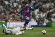 Football Soccer - Real Madrid v FC Barcelona - Spanish Liga Santander - Santiago Bernabeu, Madrid, Spain - 23/4/17 Barcelona's Lionel Messi in action Reuters / Susana Vera Livepic