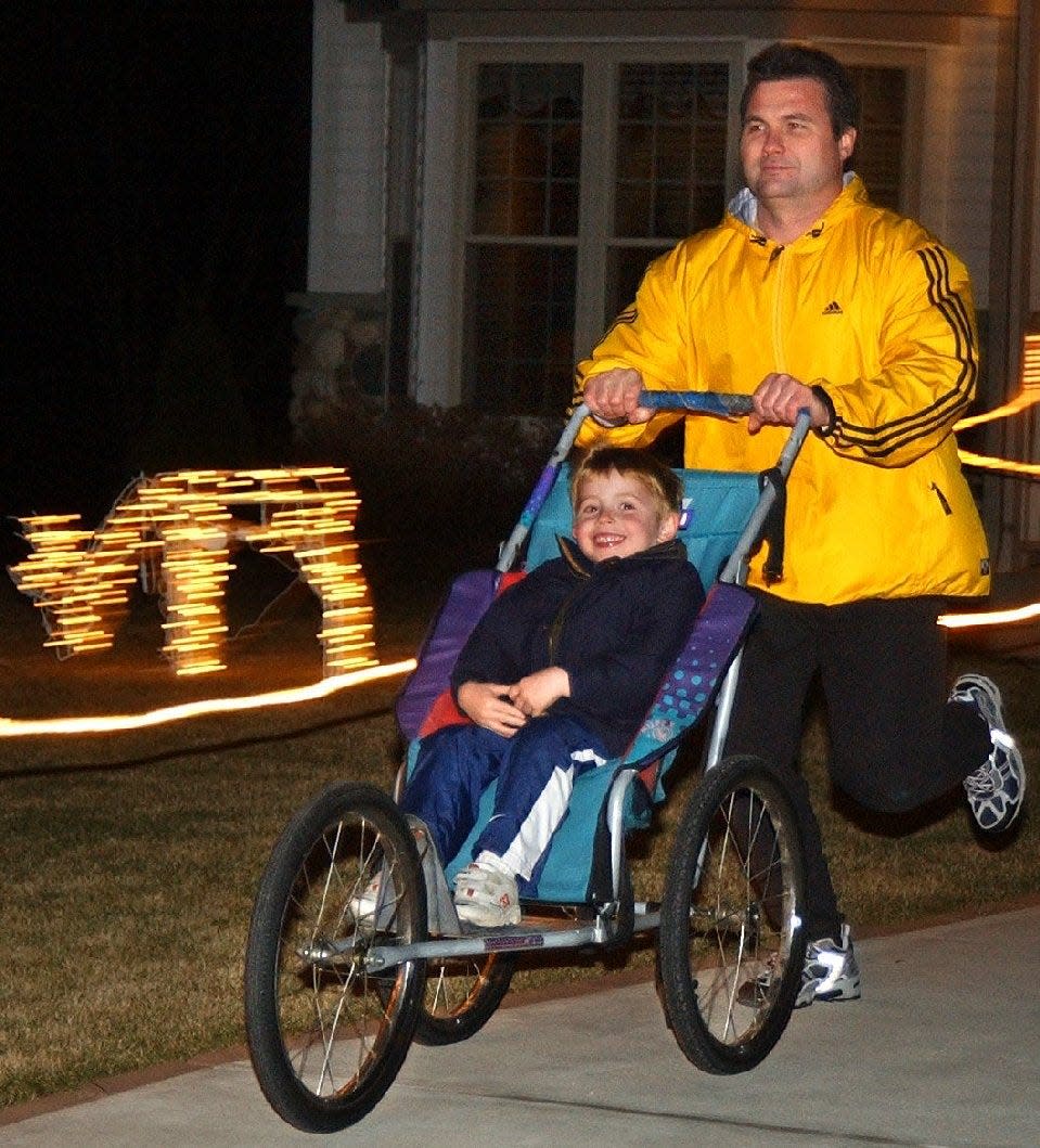 Peter Rettler has not missed a day of running in almost 30 years. Rettler is pictured running on Dec. 8, 2003, with his son, Max, who was 4 at the time. Through running, Rettler is raising funds for busing for school-aged children to visit the Wisconsin 9/11 Memorial in Kewaskum.