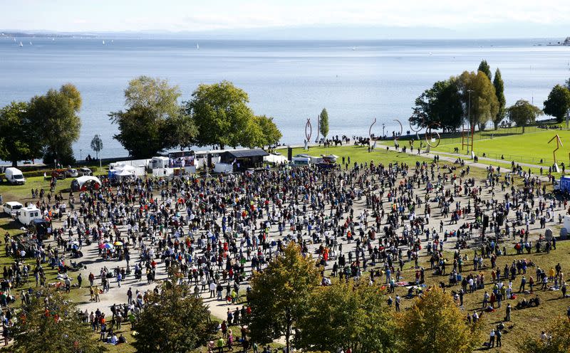 General view shows people gathering during a protest against the government's restrictions in Konstanz