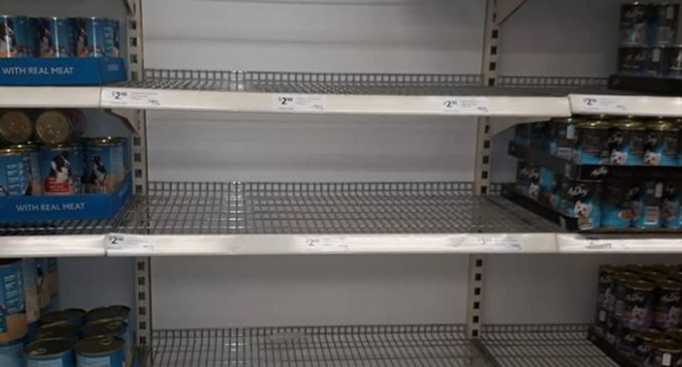 Coles and Woolworths customers are being confronted with a shortage of pet food. Pictured is a shelf in Woolworths in Sydney. Source: Facebook/ Matt Bruce-Clarke