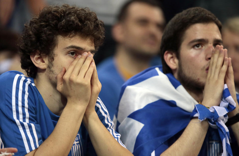 Greek fans watch the Euro 2012 soccer championship quarterfinal match between Germany and Greece in Gdansk, Poland, Friday, June 22, 2012. (AP Photo/Ivan Sekretarev)