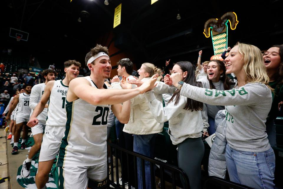 Dec 6, 2023; Fort Collins, Colorado, USA; Colorado State Rams guard Joe Palmer (20) greets fans after the game against the Denver Pioneers at Moby Arena. Mandatory Credit: Isaiah J. Downing-USA TODAY Sports