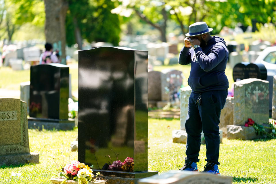 Sean Williams visit the grave of Samara Banks and her three children who were struck by a car and killed in 2013 while crossing Roosevelt Boulevard, in Philadelphia, Monday, May 9, 2022. Sean Williams is the father of Saa'mir Williams, and Saa'sean Williams. (AP Photo/Matt Rourke)