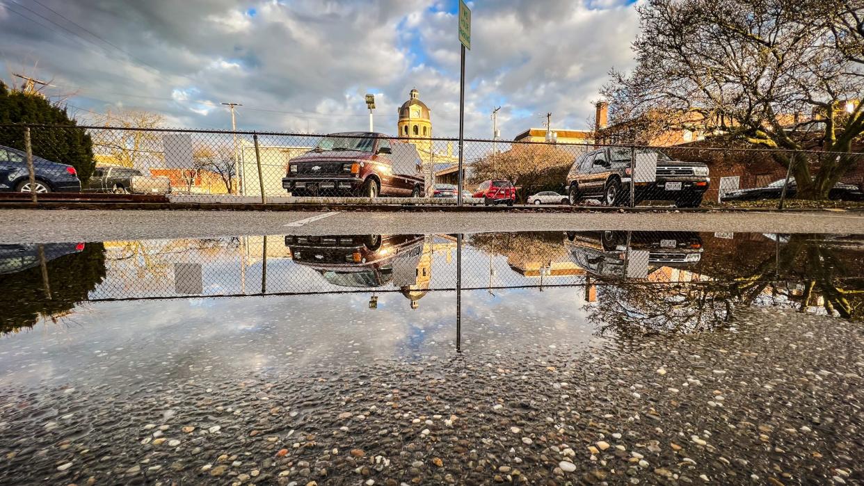 The Tuscarawas County Courthouse is reflected in rainwater Jan. 4 in New Philadelphia.