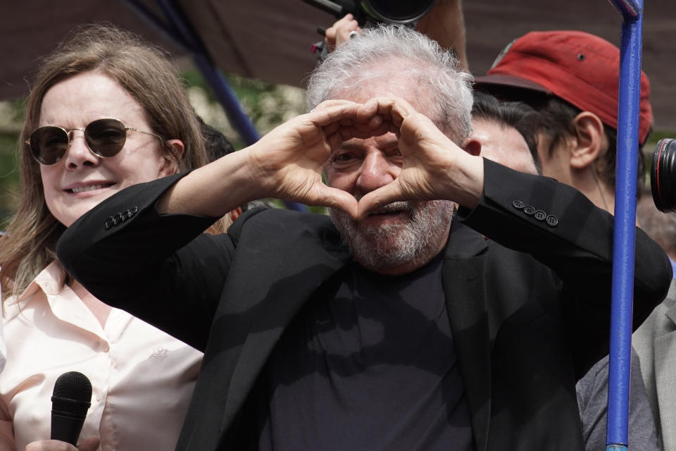 Former Brazilian President Luiz Inacio Lula da Silva flashes a heart sign during a rally at the Metal Workers Union headquarters, in Sao Bernardo, Brazil, Saturday, Nov. 9, 2019. Da Silva addressed thousands of jubilant supporters a day after being released from prison. "During 580 days, I prepared myself spiritually, prepared myself to not have hatred, to not have thirst for revenge," the former president said. (AP Photo/Leo Correa)