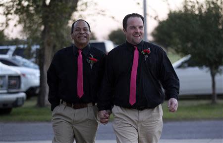 Darren Black Bear (L) and Jason Pickel arrive to be married by Darren's father Rev. Floyd Black Bear in El Reno, Oklahoma October 31, 2013. REUTERS/Rick Wilking