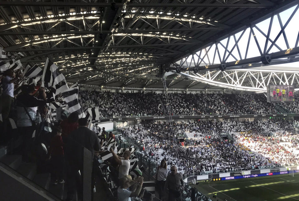 In this Sunday, March 24 2019 photo, spectators watch the Italian league women’s match between Juventus Women and Fiorentina Women in the Allianz Arena in Turin, Italy. The exceptional growth of women’s soccer took another leap forward when 39,000 people packed into the Allianz Stadium to watch Juventus Women beat Fiorentina Women 1-0 on a sunny Sunday afternoon. That was a record attendance in Italy that far eclipsed the old mark of 14,000. (AP Photo/Daniella Matar)