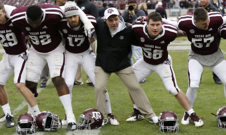 Jimbo Fisher interacting with his players before a game.