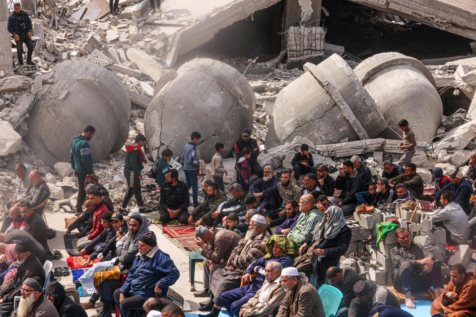 Palestinians attend the Friday noon prayers in front of the ruins of the al-Faruq Mosque, destroyed in Israeli strikes in Rafah, on March 1.<span class="copyright">Said Khatib—AFP/Getty Images</span>