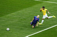 Arjen Robben of the Netherlands falls after having his shirt pulled by Brazil's Thiago Silva in the penalty box during their 2014 World Cup third-place playoff at the Brasilia national stadium in Brasilia July 12, 2014. REUTERS/Ruben Sprich