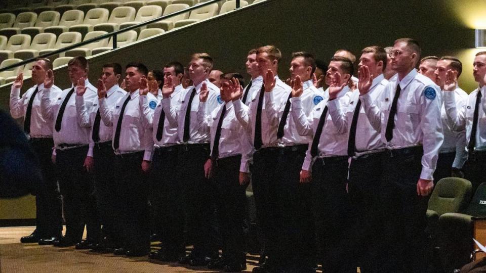 Class 69’s 27 members raised their right hand while taking an Oath of Office during their Fire Recruit Graduation at LexCity Church where they graduate to probationary firefighters for the Lexington Fire Department, December 3, 2021.