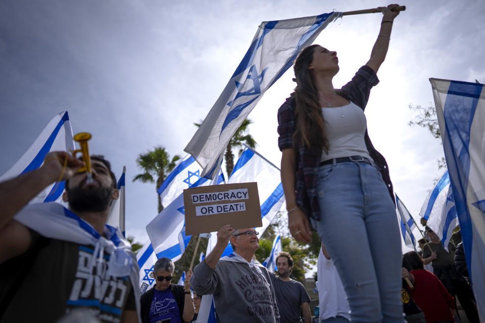 Israelis, mostly military reservists, protest against plans by Prime Minister Benjamin Netanyahu's government to overhaul the judicial system, in Tel Aviv, Israel, Wednesday, March 22, 2023. (AP Photo/Oded Balilty)