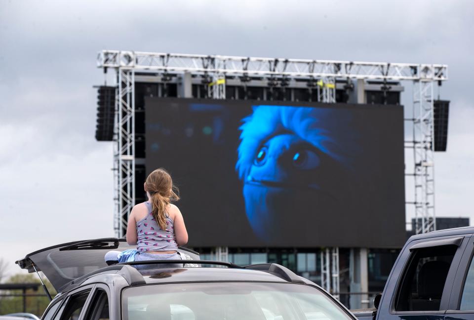 Audriana Coleman, 8, watches "Abominable" on the top of a car at the Milky Way Drive-In in Franklin during its opening weekend in 2020. The pop-up drive-in is back for a second season in 2021.