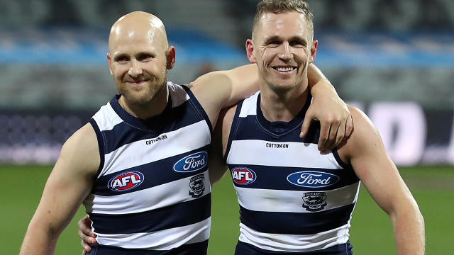 Gary Ablett and Joel Selwood, pictured here leaving the field after Geelong's victory.