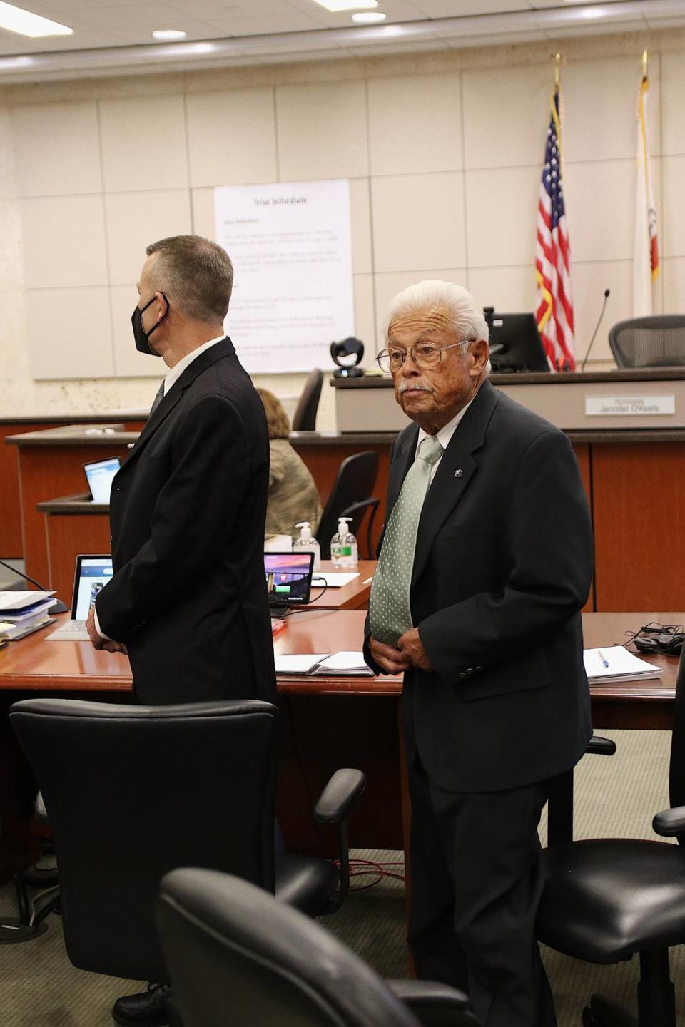 Paul Flores, left, and his father, Ruben Flores, stand in Monterey County Superior Court in Salinas on Sept 26, 2022. The two are on trial in connection with the 1996 murder of Kristin Smart.