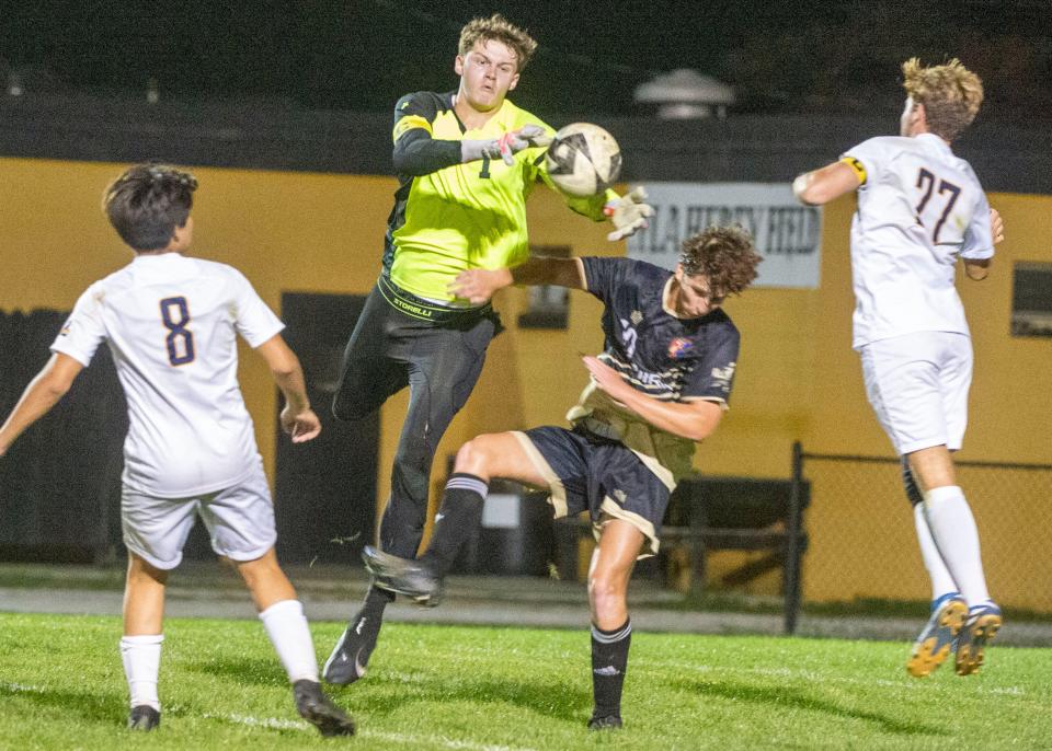 Littlestown's Christopher Meaken comes out from the goal to take the ball before Delone Catholic's Michael Carter can try a shot on Thursday, Oct. 5, 2023.