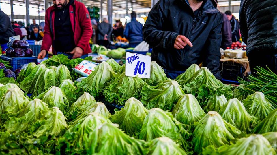 lettuce for sale seen on display at a market stall