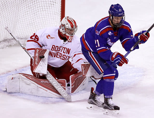 BOSTON, MA – JANUARY 28: Boston University Terriers goalie Jake Oettinger (29) makes a blocker save as Massachusetts-Lowell River Hawks forward Jake Kamrass (21) looks to redirect the shot. BU hosts UMass-Lowell in a Hockey East game at Agganis Arena in Boston on Jan. 28, 2017. (Photo by Barry Chin/The Boston Globe via Getty Images)