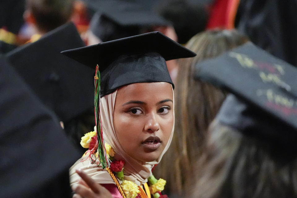 Asna Tabassum sits during commencement for the University of Southern California's Viterbi School of Engineering Friday, May 10, 2024, in Los Angeles. (AP Photo/Ryan Sun)