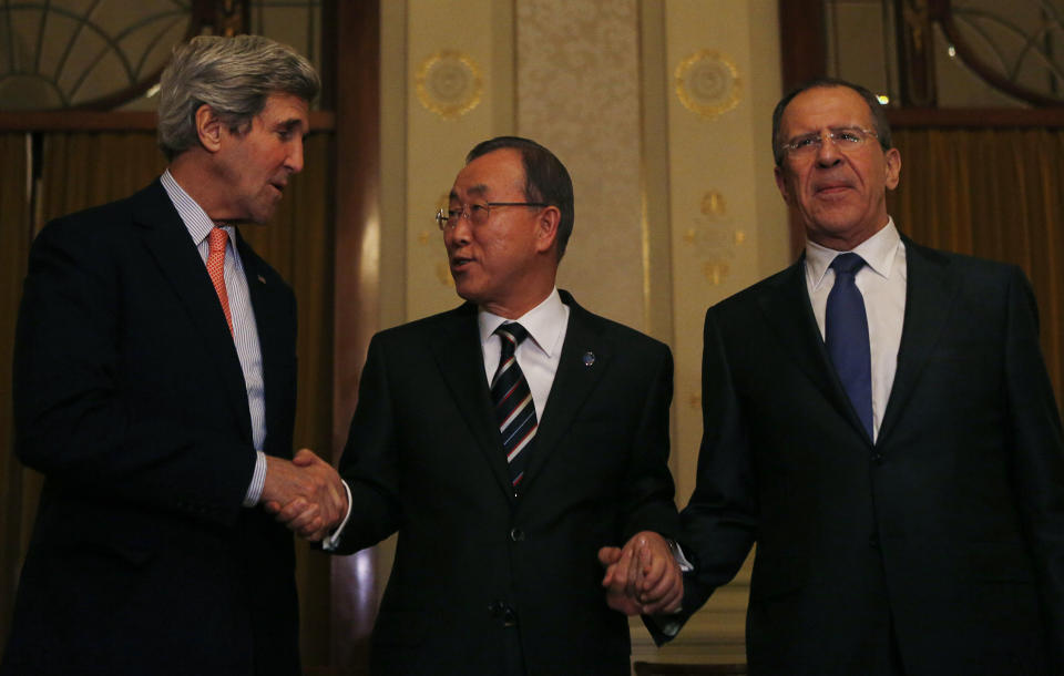 United States Secretary of State John Kerry, left, U.N. Secretary-General Ban Ki-moon and Russia's Foreign Minister Sergey Lavrov, right, join hands after their tri-lateral meeting on ending the crisis in Syria in Montreux, Switzerland, Tuesday, Jan. 21, 2014. Syria's main political opposition group in exile agreed on Saturday to attend internationally sponsored peace talks, and said for the first time three rebel fighting forces also wanted to take part. (AP Photo/Gary Cameron, Pool)