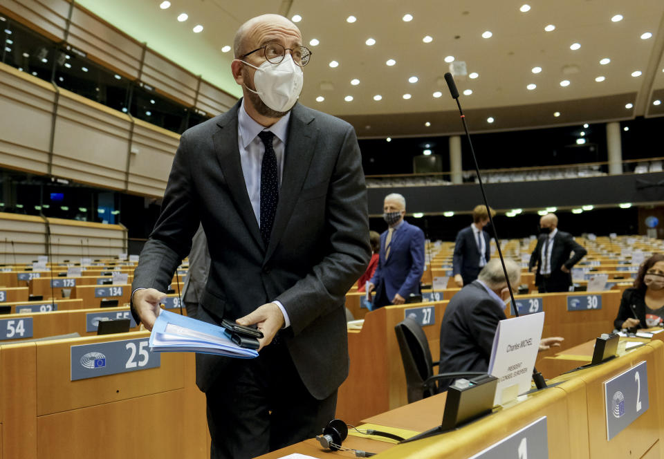 European Council President Charles Michel arrives ahead of addressing MEP's on a report of last weeks EU summit during a plenary session at the European Parliament in Brussels, Wednesday, Oct. 21, 2020. (Olivier Hoslet, Pool via AP)