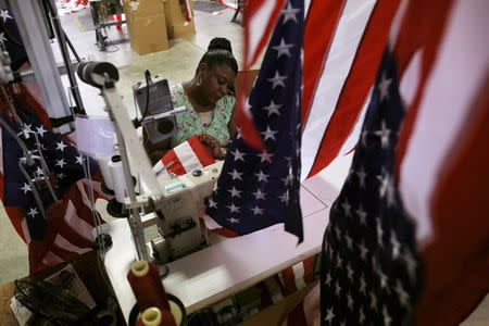 Sylvia Bull cuts and sews U.S. flags at Valley Forge's manufacturing facility in Lane, South Carolina June 23, 2015. REUTERS/Brian Snyder