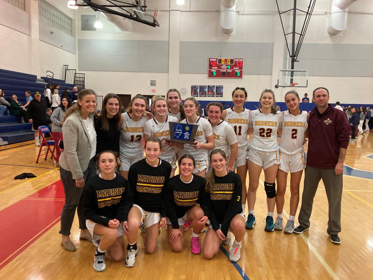 Madison celebrates after defeating Secaucus to win the NJSIAA North 2, Group 2 girls basketball title on March 1, 2024.