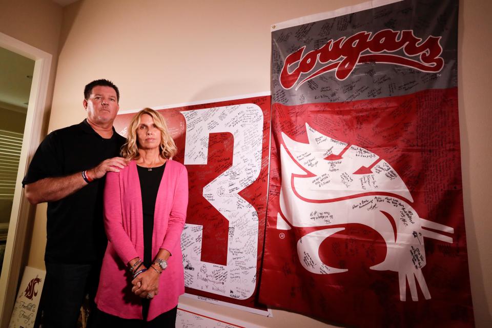 Mark and Kym Hilinski pose for a photo at their home on Aug. 21, 2018, in Irvine, Calif. The parents of Washington State quarterback Tyler Hilinski, who killed himself in Pullman, Wash., in January 2018, have become advocates for greater awareness of mental health issues among student-athletes and are channeling their energy into Hilinski's Hope, a foundation created to bring resources to bear on the issues. (AP Photo/Chris Carlson)
