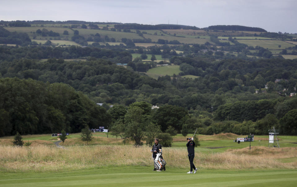 Spain's Carlos Pigem plays from the fairway during day one of the British Masters at Close House Golf Club, near Newcastle, England, Wednesday July 22, 2020. The European Tour resumes in earnest after its pandemic-induced shutdown with the British Masters starting Wednesday with plans for players and caddies to be virus tested regularly during the week. (Mike Egerton/PA via AP)