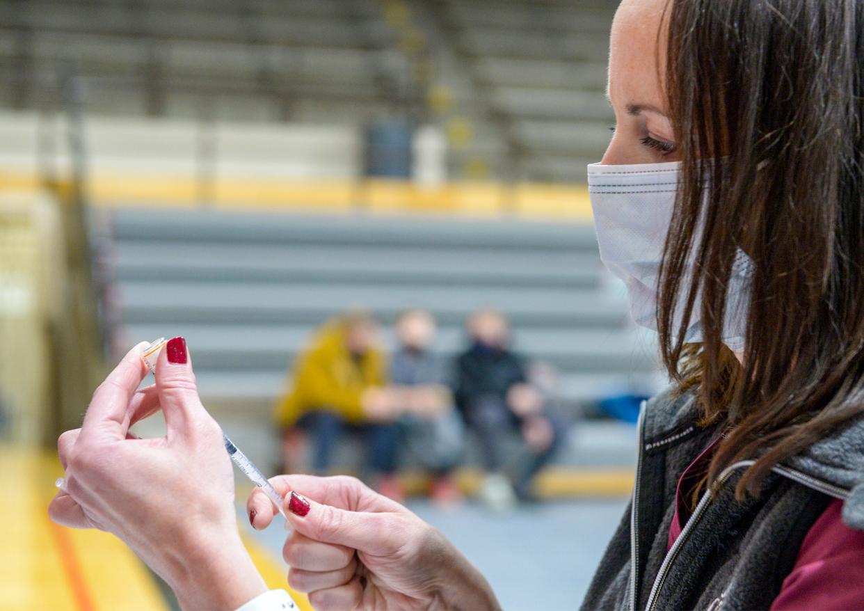 Erica Harp, lead nurse for Great Falls Public Schools, draws up a dose of the pediatric Pfizer COVID-19 vaccine during an Alluvion vaccine clinic on Wednesday at Paris Gibson Education Center.