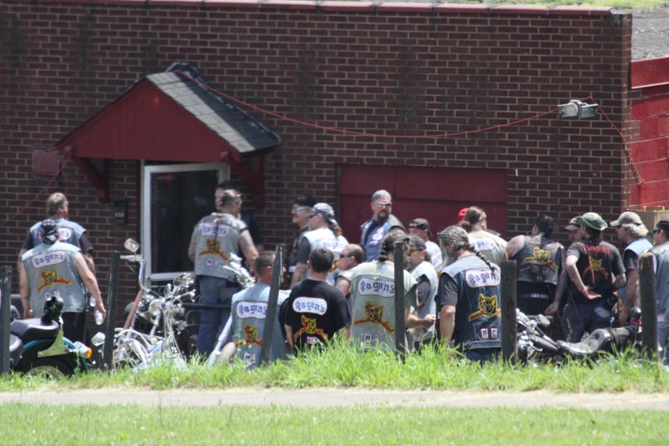 The Pagans, an outlaw motorcycle club, are the subject of the new book "Riding with Evil," co-written by Ken Croke and South Shore author Dave Wedge. Croke is in the middle wearing a bandana and sunglasses.