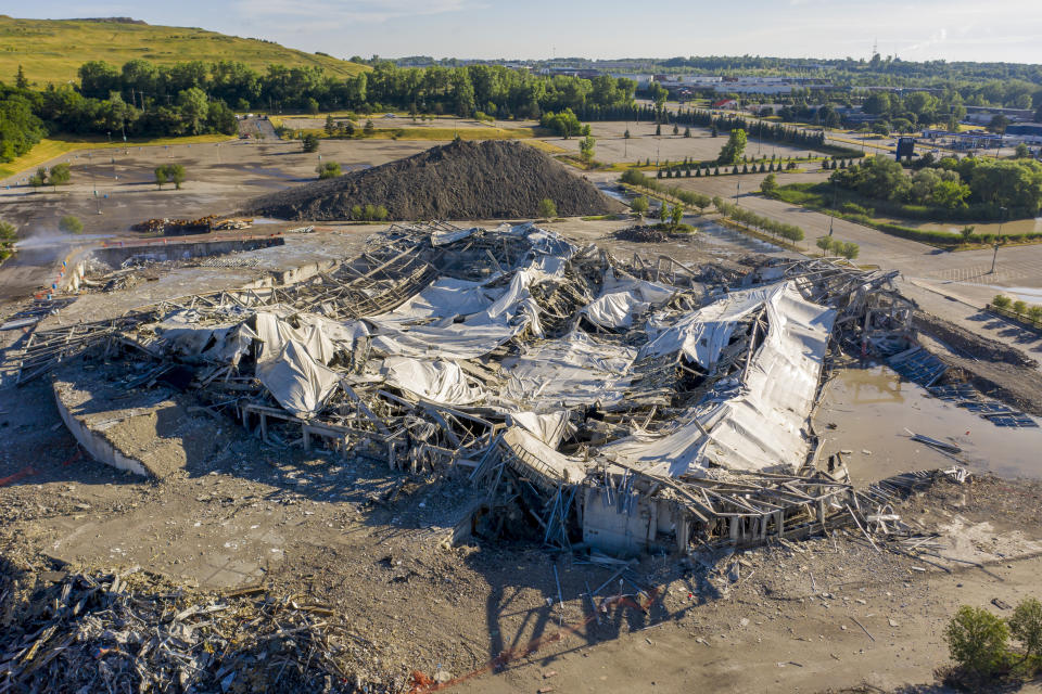 The Palace of Auburn Hills lies in rubble after undergoing a controlled demolition in Auburn Hills, Mich., on Saturday, July 11, 2020. Opened in 1988, the multi-use stadium was the home of the Detroit Pistons as well as numerous concerts and sporting events. (David Guralnick/Detroit News via AP)