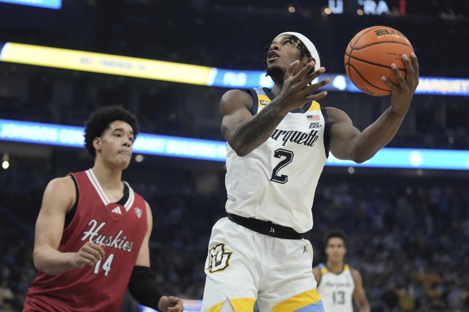 Marquette's Chase Ross shoots past Northern Illinois's Yanic Konan Niederhauser during the first half of an NCAA college basketball game Monday, Nov. 6, 2023, in Milwaukee. (AP Photo/Morry Gash)