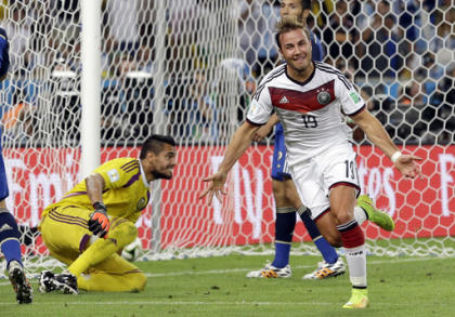 Germany&#39;s Mario Goetze celebrates after scoring the opening goal during the World Cup final soccer match between Germany and Argentina at the Maracana Stadium in Rio de Janeiro, Brazil, Sunday, July 13, 2014. Germany won 1-0 to win the World Cup. (AP Photo/Victor R. Caivano)