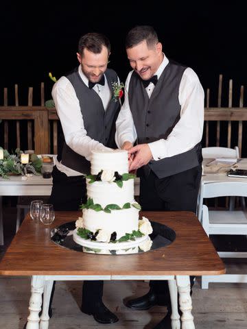 <p>William McClintic/Heather Carpenter</p> Alex Schwartz (left) and Ty Herndon cut their wedding cake.