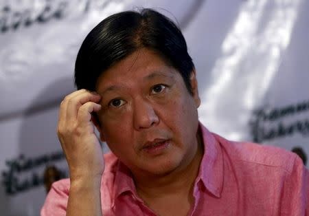 Philippine Senator Ferdinand Marcos Jr., son of late dictator Ferdinand Marcos, gestures while listening to a question during a forum at a bakery in Quezon city, metro Manila October 7, 2015. REUTERS/Romeo Ranoco