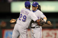 ST LOUIS, MO - OCTOBER 20: Adrian Beltre #29 and Michael Young #10 of the Texas Rangers celebrate after defeating the St. Louis Cardinals 2-1 during Game Two of the MLB World Series at Busch Stadium on October 20, 2011 in St Louis, Missouri. (Photo by Jamie Squire/Getty Images)