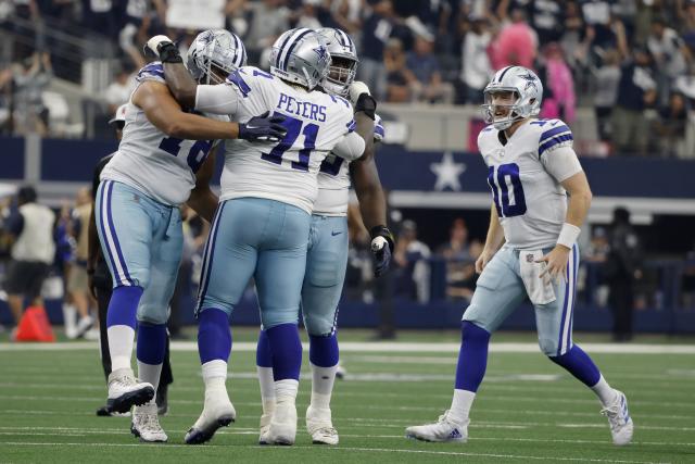 Dallas Cowboys quarterback Cooper Rush (10) celebrates after a