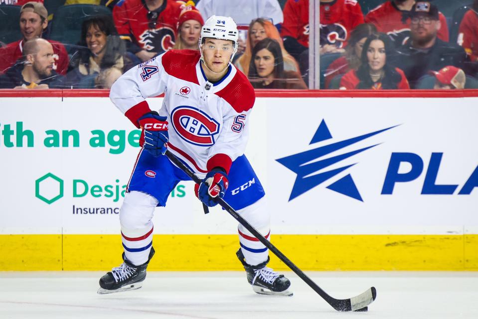 Mar 16, 2024; Calgary, Alberta, CAN; Montreal Canadiens defenseman Jordan Harris (54) controls the puck against the Calgary Flames during the first period at Scotiabank Saddledome. Mandatory Credit: Sergei Belski-USA TODAY Sports