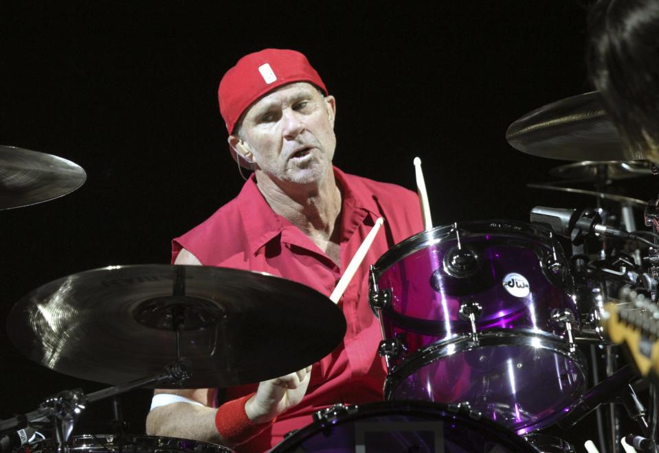 Though he’s wearing red here, Chad Smith is a big Michigan Wolverines fan.<br>(Photo by Robb Cohen/Invision/AP)