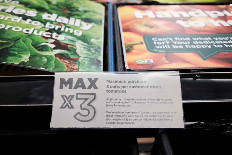 Empty fruit and vegetable shelves at an Asda in east London with Max x3 signs (PA Wire)