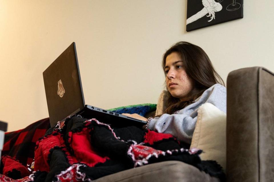 First year business student Vanessa Alamio checks emails on her couch at 650 Lincoln. Sitting on this same couch, Vanessa discovered that she was not selected to work in university housing for the 2024-2025 school year.