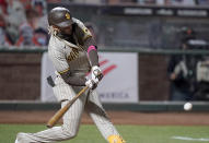 San Diego Padres' Fernando Tatis Jr. hits a two-run home run against the San Francisco Giants during the first inning of the second game of a baseball doubleheader Friday, Sept. 25, 2020, in San Francisco. (AP Photo/Tony Avelar)